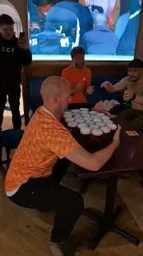 The incredible moment a Dutch fan carries TWENTY SIX pints of Tennents at Scottish pub
