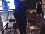 Shocking moment Michigan female student knocks out teacher with chair