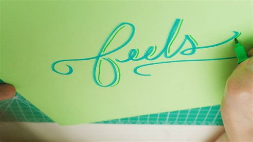 Calligrapher detailing the word Feels - Free Stock Video