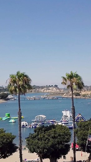 7.1K views · 96 reactions | The countdown is on! Our epic Inflatable Water Park opens one week from today - Friday, May 26th! Kids and adults alike will have a blast on over 15 inflatables including a 17-foot slide, a floating trampoline, jingle gym, giant iceberg, monkey bars, bouncers and slides. You can reserve your slot on the park up to 45 days in advance. Visit the link in our bio for all the details. | Newport Dunes Waterfront Resort | Facebook