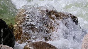 Video of Altai river Chulyshman. Boulders in river rapids. Boulders are on foreground