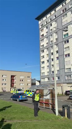 Armed police entering Cobbinshaw House in Calder where a man is believed to be barricaded inside a flat after two people were injured. They have been taken to hospital. Police Scotland say the incident is contained and there's no wider risk to the suspect.