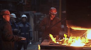Workers engaged in Steel Production A detailed glimpse into the intricate Foundry Process. Stock Clip