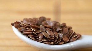 Flax seeds falling in slow motion