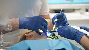 Dentist Perform Dental Implantation Operation On Patient At Dentistry Clinic. Close Up