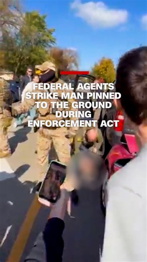 CNN on Instagram: "Video shows federal agents repeatedly striking a man on the ground in a Chicago suburb. The Department of Homeland Security says the agents were conducting an immigration enforcement operation at the time. Read more at the link in our bio."