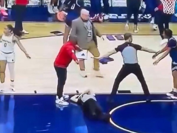 Referee injured after being caught in crossfire during wild college basketball brawl