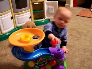 Deaken playing with his ball popper