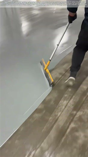 Epoxy Application: Spreading a Smooth Floor Coating with a Squeegee