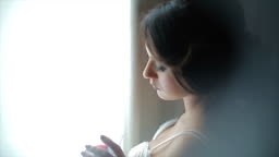 Attractive bride with a glass of wine