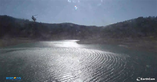 55K views · 1K reactions | This web cam at Grindstone Lake near Ruidoso captured one of the firefighting helicopters sucking up water to put out the Flume Fire earlier today. Tonight, that fire is 100% contained thanks to these firefighters. (Posted 10:30 PM 5/26/25) | Meteorologist Grant Tosterud | Facebook