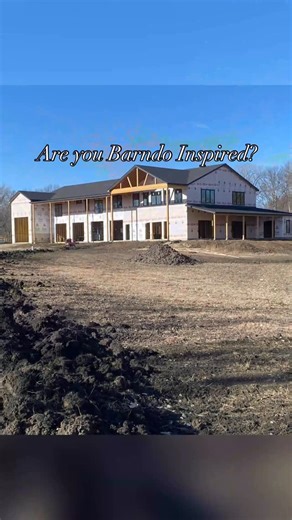 Stacee Lynn on Instagram: "This custom post frame black Barndo going up in Kansas is what dream builds are made of 🖤 From the mix of stone and wood accents to the endless covered porches — every detail screams luxury living. Inside, it’s all about entertainment and comfort. A huge gourmet kitchen, a pass-through window bar to the back porch from the garage kitchen and even an outdoor kitchen setup on the back porch! Count them…3 kitchens!!! Add in the office, loft with built in wet bar and four