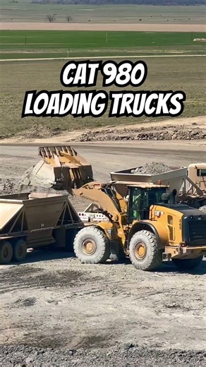 Caterpillar 980 loading trucks in the mine.