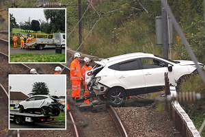 Driver injured as car collides with train on Scots tracks with cops on scene