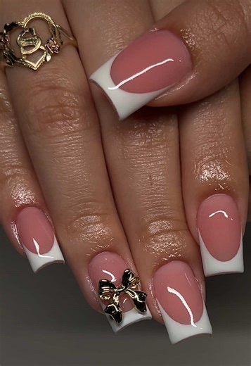 Elegant White French Tips with Gold Bow Design