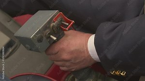 View at pilot hand on control lever of flying helicopter. Camera inside. Pilot cabin. Handle. Transportation