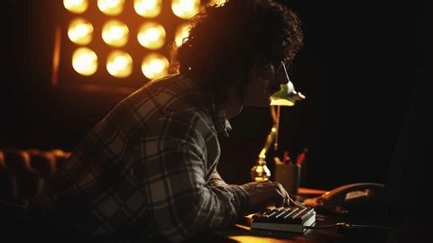 clip-4010558443-nerdy-guy-troubleshooting-program-bugs-on-retro