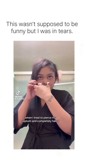 Stonky funny on Instagram: "The post shares a viral TikTok clip of a woman's botched DIY septum piercing attempt, where she accidentally pierces the side of her nose instead, eliciting uncontrollable laughter from the poster despite the mishap's pain. With over 1 million views and 13,000 likes in under 24 hours, the thread draws humorous replies mocking the poor aim and urging professional piercings, highlighting social media's appetite for relatable fail videos. DIY piercings like this carry hi