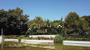 Los Angeles, California, USA, June 21, 2022: TILT SHOT - The Beverly Hills Sign. A 40-foot arched sign is located on Santa Monica Boulevard in Beverly Gardens Park.
