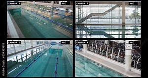 Four security camera views of large swimming pool sports facility interiors, slow motion Stock Video