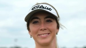 Grace Charis narrowly avoids wardrobe malfunction in a low-cut top during golf