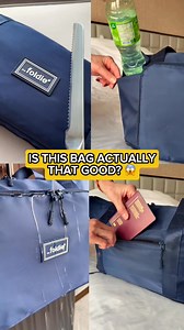 Is this bag actually that good? Spot the fake feature 👀 Folds like a notebook, holds a week’s wardrobe, weighs just 1.05 lbs but carries up to 66 lbs, fits as a personal item, saves you baggage fees, and has waterproof pockets. 🎯 Try it yourself — buy one now & get a second Foldie FREE! | The Foldie