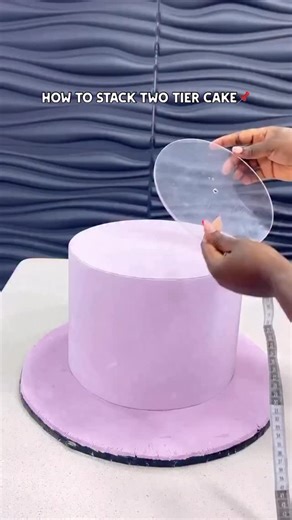 Gracegao Icing Sugar on Instagram: "Tutorial on how to stack a two tier fondant cake. Enjoy BTS ✌️ Don’t forget to elevate your creation with our premium icing sugar @gracegaoicing 💙 To become a Gracegao Icing Sugar Distributor/Bulk Buyer and CASH OUT! Send us a dm or use the link in BIO! 📞 WhatsApp: +234 803 430 0220 🎥: @cakesbysharawow #gracegaoicingsugar #tutorial #viral #fyp"