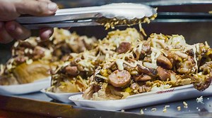 Welcome to the Encyclopedia of Latin American Food. In this first episode we talk about the hotdogs of Medellin, Colombia, which replace the original hot dog sausage with bacon slices, and are topped with double melted cream cheese and shoestring fries. | Munchies