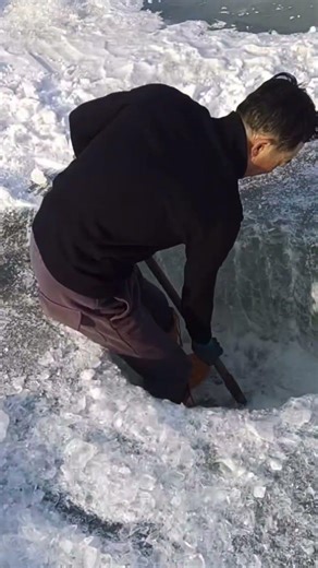 Digging ice holes to catch fish