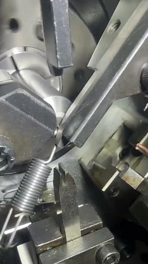 the process of making small springs from sophisticated machines quickly and perfectly