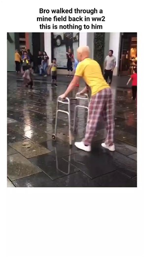 memes on Instagram: "The post showcases a 23-second video of an elderly man using a walker to navigate an interactive urban fountain with random colored water jets, captioned to humorously portray him as a unflappable WWII veteran treating it like a minefield. Posted on January 9, 2026, by @vidsthatgohard —a meme and video archive account—it quickly amassed 50,000 views and 500 likes, sparking replies that laud his agility as "ultra instinct" while joking about passive bystanders. Some reactions
