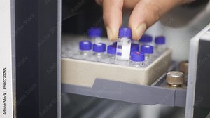 Fda approved hplc lab, close up of science experiment Vials filling inside an autosampler of an HPLC machine inside view in a Science experiment laboratory research development analysis