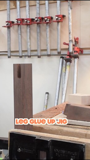 Gluing in an irregular angled table leg. The scrap piece gives me parallel (ish) surfaces to clamp to. Also, nearly lopped the tip of my finger off the day before with a sharp chisel, so had wrapped the sucker up with a nitrile glove an blue tape. #woodworking #reels #glueup #furnituremaker #woodshop | Boundary Fog Furniture