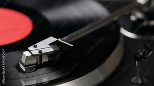 Vintage turntable record player with vinyl disc, close-up.