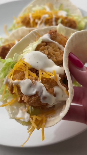 (Recipe Below)✨✨This McDonald’s Snack Wrap Recipe is incredibly easy and delicious – plus it tastes just like the real deal! Just add crispy chicken tenders (straight from the freezer) to tortillas with shredded lettuce, cheddar cheese, and ranch dressing. You’ll have a homemade version of the sadly discontinued menu item ready in less than 15 minutes. This snack sized lunch or dinner is so wonderfully nostalgic – you won’t be able to get enough! Ingredients 4 flour tortillas, street taco sized 