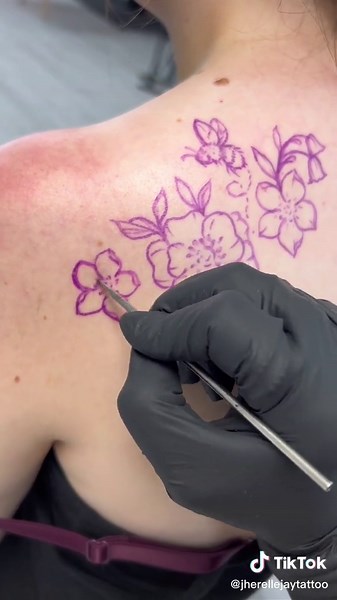 Freehand Tattoo Artist Creates Stunning Floral Design for Customer