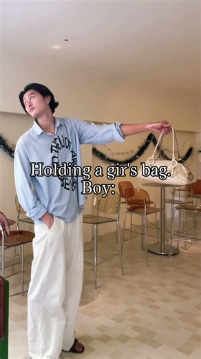 Man vs boy holding a girl’s bag