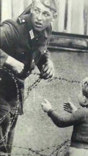 Bravery Unseen: East German Soldier Lifts Boy Across Berlin Wall, 1961