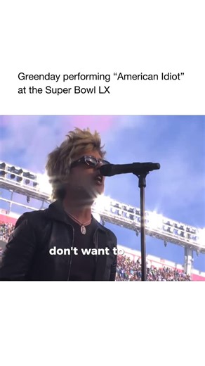 Good Music on Instagram: "Green Day kicked off the Super Bowl LX opening ceremony with sheer punk energy tearing into a set that included “Holiday,” “Boulevard of Broken Dreams” and an electrifying rendition of their anthem “American Idiot.” ￼ Originally released in 2004, “American Idiot” isn’t just a song — it’s a cultural lightning bolt. Written against the backdrop of post-9/11 America, its driving guitars and explosive chorus challenge media manipulation and political fear-mongering, capturi