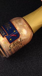 138K views · 7.8K reactions | A scented sheer gold topper with holographic confetti that leaves the cozy, sweet scent of BUTTERBEER™ behind after it dries, adding a whimsical touch to manicures and pedicures. Shimmer: A sheer gold shimmer with subtle pink reflective undertones and gold holographic confetti adds sparkle and dimension to your nails. Iconic BUTTERBEER™ Scent: Infused with the irresistible fragrance of BUTTERBEER, revealed after your manicure dries. | ORLY | Facebook