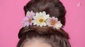 59K views · 684 reactions | Spring is in the air... and in our hair! Learn how to get this flower crown bun. | AwesomenessTV | Facebook
