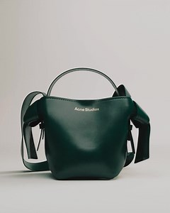 #AcneStudios classics, made for gifting. Discover our seasonal Musubi bag in a new deep green aged leather. Discover the gift guide online. | Acne Studios