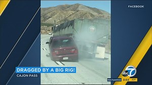 VIDEO: Semi drags car along California interstate