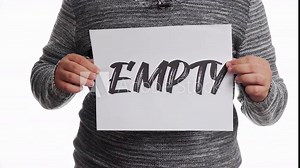 A person holding a sign with the message and the word "empty"