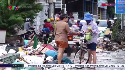 Vietnam begins clean up after worst flooding in decades which left dozens dead