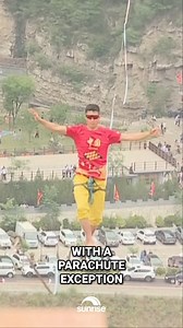 A dare devil tight-rope walker has crossed a gorge 200 metres above ground 😅 Would you ever slack line? We know who definitely wouldn't... 👀 ☀️ Sunrise is streaming now on 7plus ☀️ | Sunrise