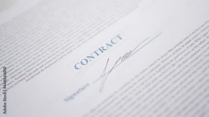 Signing a Contract Document With a Pen closeup