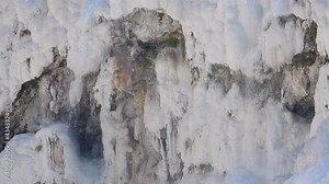White travertine rock formed with the calcium carbonate mineral in the water.Sedimentary deposited by waters from hot spring.Travertines terrace formations.Cotton castle natural world heritage site 4K