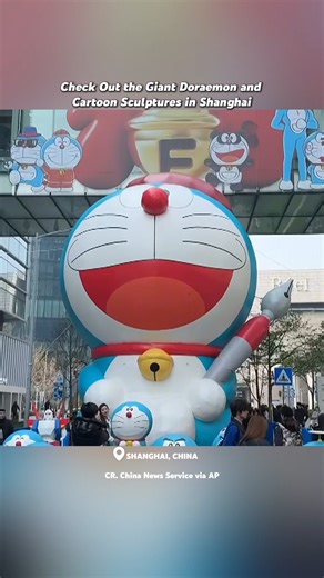 🎈All Doraemon fans! A 12-meter-tall inflatable Doraemon just landed in Shanghai!！ And it's not alone! Nearly 100 cartoon and movie sculptures are here to party. 82 life-size Doraemons are lining the streets, striking classic movie poses and showing off creative designs. Come join the fun and snap some pics with your favorite blue cat! 📸 #Doraemon #Shanghai #Adventure #Cartoon #Chinatravel #DiscoverChina | 華夏focus