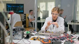 Woman testing processor before installing it in computer